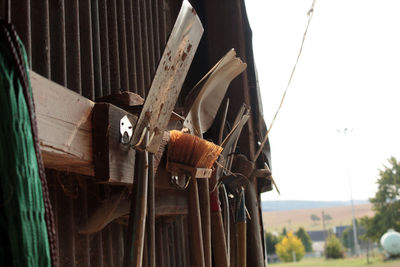 Close-up of clothes hanging on rope against sky