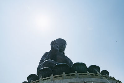 Low angle view of statue against sky