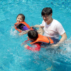 High angle view of children in swimming pool