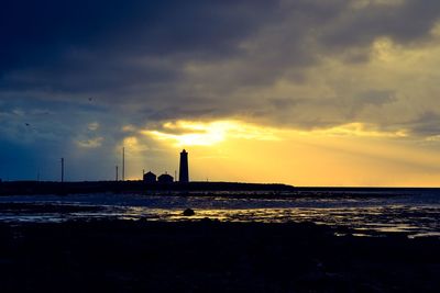 Scenic view of sea against sky at sunset