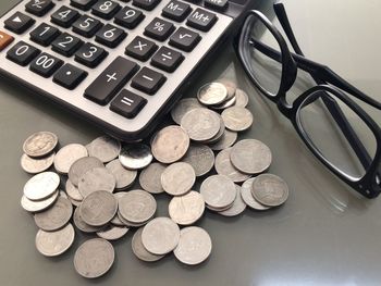 High angle view of coins on table