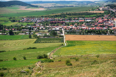 High angle view of agricultural field against houses