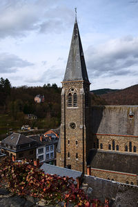 Clock tower against cloudy sky