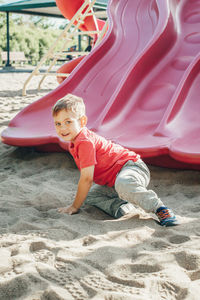 Portrait of cute boy playing in playground