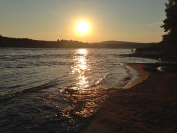 Scenic view of sea against sky at sunset