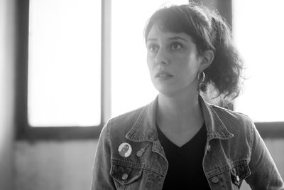 Portrait of young woman looking away