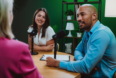 Portrait of young woman working at table