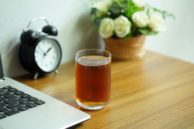 High angle view of coffee and wine on table