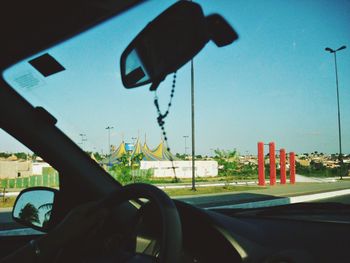 Close-up of road sign in car
