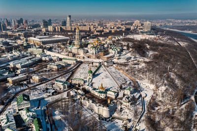 Beautiful winter top view of the kiev-pechersk lavra. many churches in the snow.