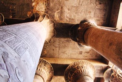 High angle view of buddha sculpture on table at temple