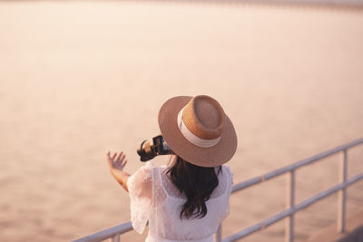 Rear view of woman looking at sea