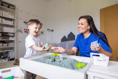 Portrait of smiling friends working at home