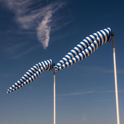 Low angle view of balloon against cloudy sky