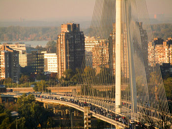 View of suspension bridge with city in background