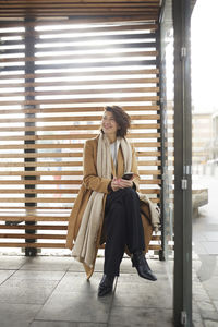 Smiling businesswoman looking away