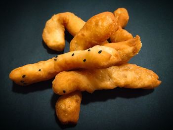 High angle view of bread on table against black background