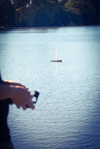 Man sailing on boat in lake