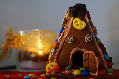 Close-up of gingerbread cookie house on table