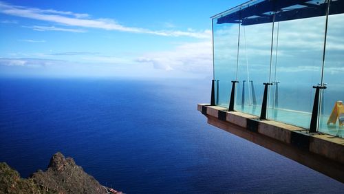 Scenic view of sea against blue sky