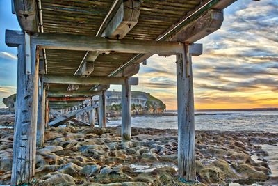 Built structure on beach against sky