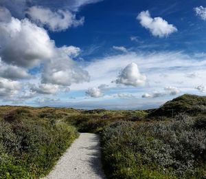 View of landscape against cloudy sky
