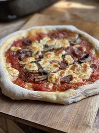 Close-up of pizza on cutting board