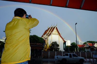 Rainbow over buildings