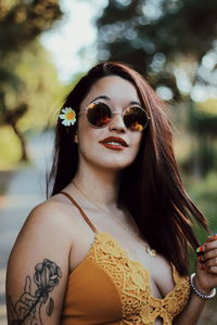 Portrait of young woman wearing sunglasses