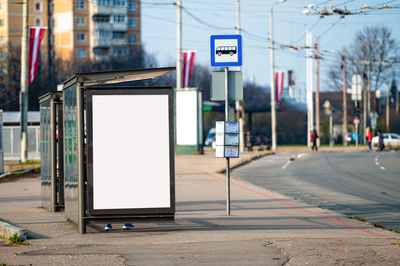 Blank billboard with copy space ready for design at bus stop, outdoor advertising concept, mockup