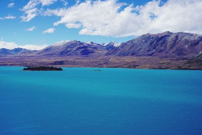 Scenic view of sea against blue sky