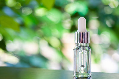 Close-up of glass bottle on table