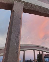 Low angle view of bridge against sky during sunset