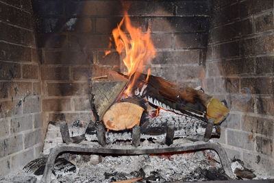 Firewood burning in fireplace
