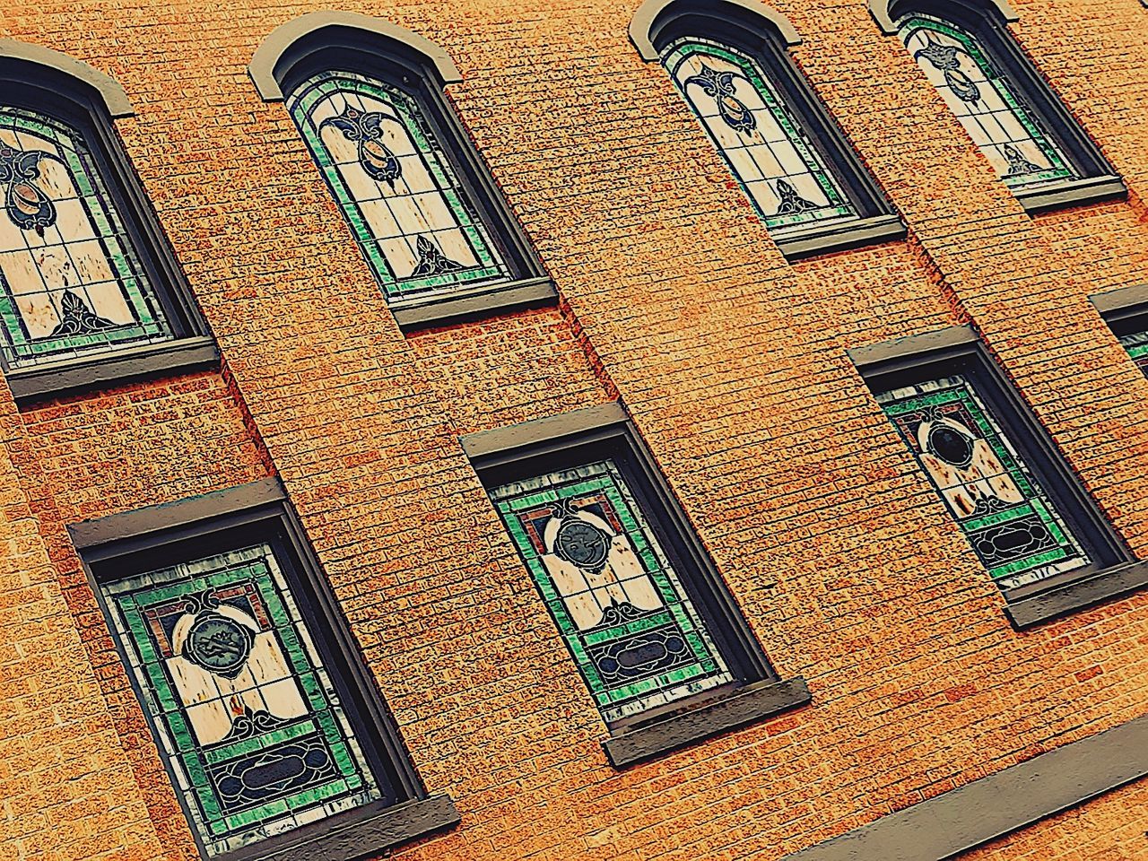 architecture, built structure, building exterior, window, low angle view, no people, day, building, brick wall, brick, full frame, outdoors, wall - building feature, wall, tilt, pattern, residential district, religion, old, the past, mural