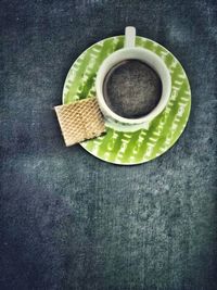 High angle view of coffee cup on table