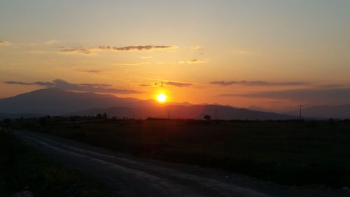 Scenic view of landscape against sky during sunset