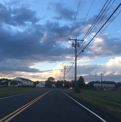 Empty road along countryside landscape