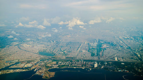 Aerial view of cityscape against sky