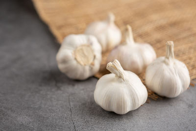 Close-up of white garlic on table