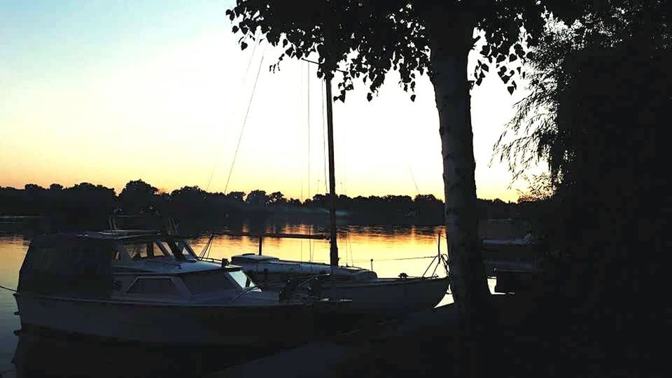 SUNSET OVER CALM LAKE