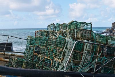 Panoramic view of fishing net on sea against sky