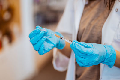 Cropped image of hand holding umbrella