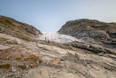 People hiking on mountain during winter