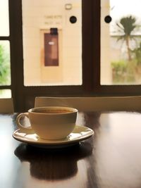 Coffee cup on table in cafe