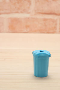 High angle view of dustbin on hardwood floor