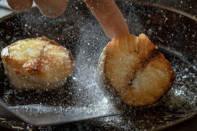 Close-up of hand holding ice cream