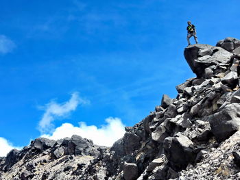 Low angle view of rock formation against blue sky