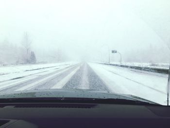Road passing through foggy weather