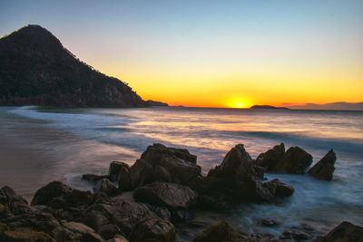 Scenic view of sea against sky during sunset